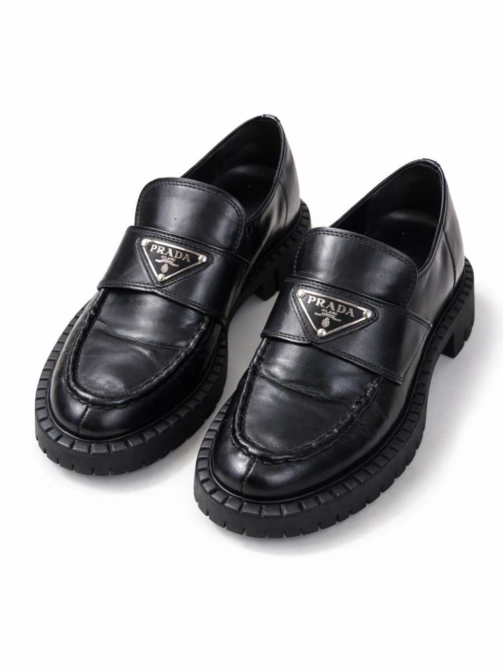 Prada Black Leather Penny Loafers With Metal Triangle Logo